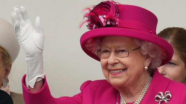 Britain's Queen Elizabeth II waves to guests during the Patron's Lunch in The Mall, central London in honour of the her majesty's 90th birthday, Sunday June 12, 2016.