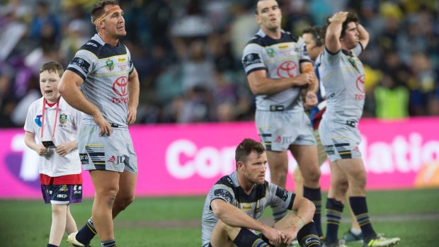 Dejected: North Queensland Cowboys after Sunday's grand final loss.