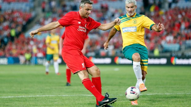 Winding back the clock: New PFA chairman Craig Foster in action against the Liverpool Legends team.