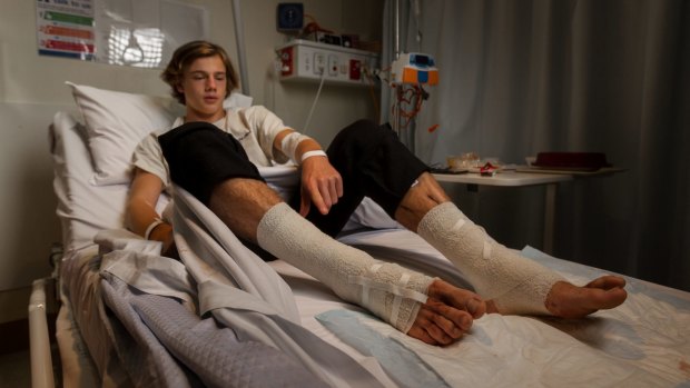 Still in shock: Sam Kanizay's wounds were seeping blood at Dandenong Hospital on Sunday, 18 hours after he emerged from the bay at Brighton with bloody legs, possibly by tiny bay creatures.