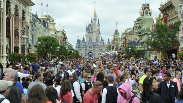 Crowds fill the main avenue in Walt Disney World, Orlando.