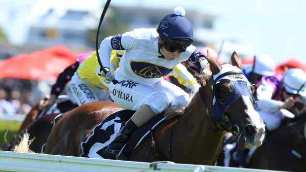Golden opportunity: Kathy O'Hara rides Scarlet Rain to victory in the Sweet Embrace Stakes at Randwick. 