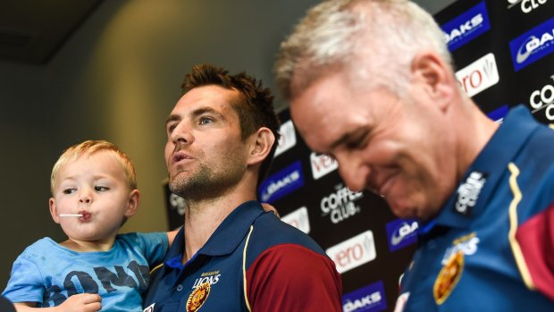 Hodge's son Leo crashes the press conference on Wednesday.