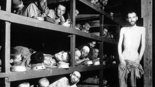 This April 16, 1945 file photo provided by the US Army shows inmates of the  Buchenwald concentration camp. The young man seventh from left in the middle row bunk is Elie Wiesel.
