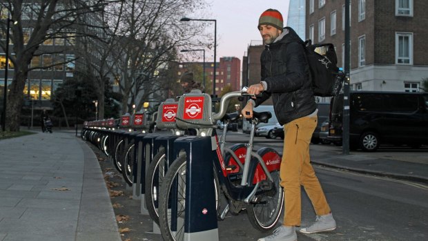 A man takes a Santander bike in London on Monday.