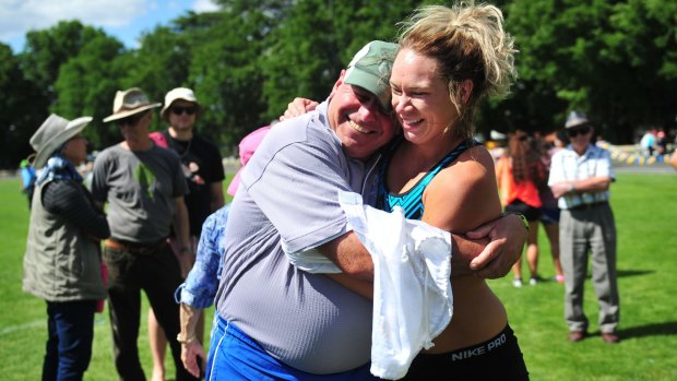 Sophie Broadhead and coach Dennis Goodwin celebrate her win in the women's Queanbeyan Gift.