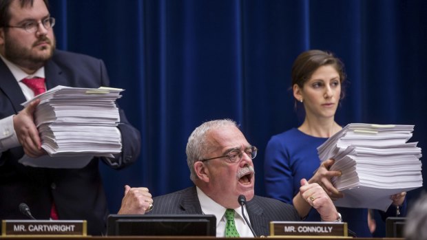Controversy: Democratic congressman Gerry Connolly points to stacks of documents during a Capitol Hill hearing where  Michigan governor Rick Snyder testified about Flint's water crisis.