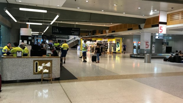 The Qantas domestic terminal is deserted as a storm hits Sydney.