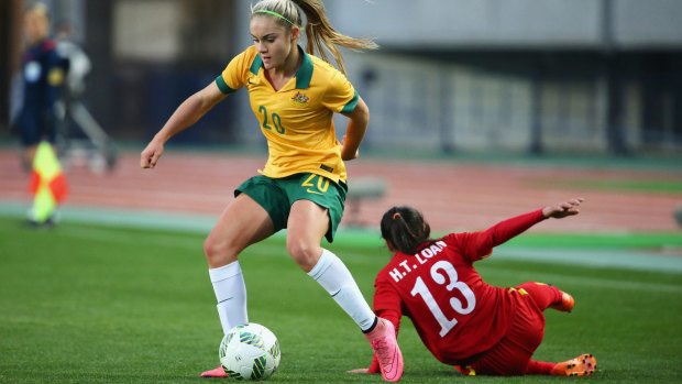 Rising star: Ellie Carpenter competes for the ball against Vietnam during the Matildas' Olympic qualifiers.

