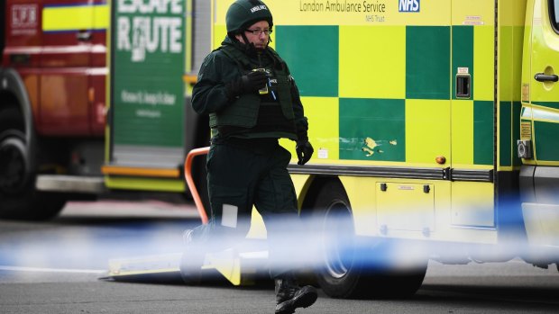 A paramedic in body armour runs down Westminster Bridge on Wednesday.