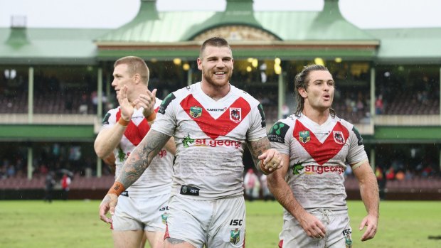Happy Dragons: Ben Creagh, Josh Dugan and Mitch Rein celebrate their victory over the South Sydney Rabbitohs.