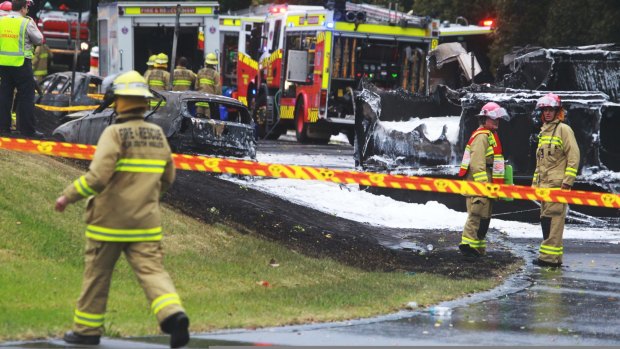 Firefighters at the scene of the Mona Vale crash that left two people dead. 