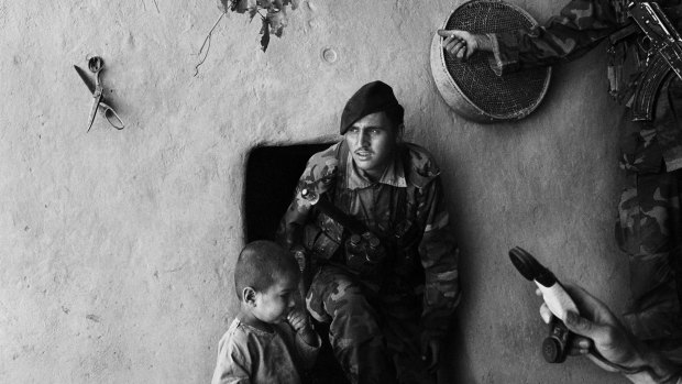 Afghan special forces search houses in Kandahar. 