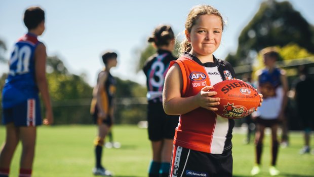 Ainslie player Elise Doherty, 7, is forming part of the junior footy resurgence.