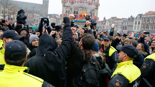 Racial debate: Police control demonstrators protesting against the ''Black Pete" celebration in Gouda.
