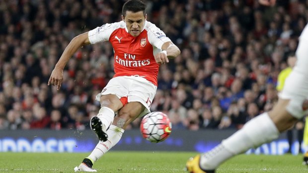 Arsenal's Alexis Sanchez scores his side's second goal from a free kick.