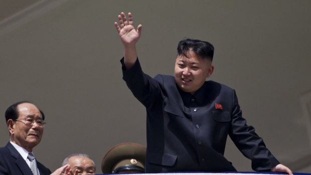 North Korean leader Kim Jong Un waves from a balcony at the end of a mass military parade in Pyongyang in 2012.