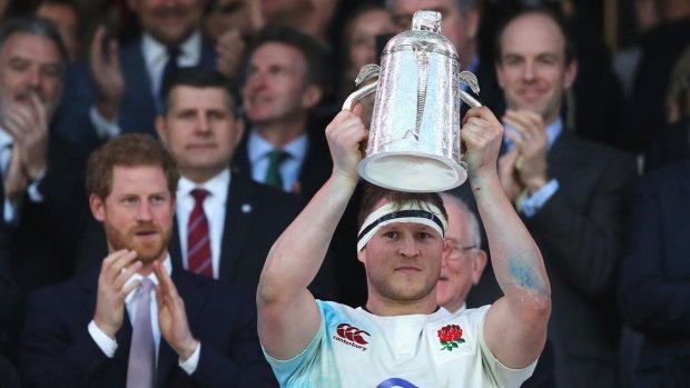 Dylan Hartley of England lifts the The Calcutta Cup.
