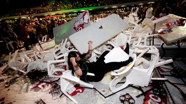 Elements of the crowd at Darts Invitational Challenge trashed chairs and tables.