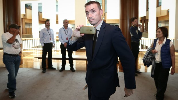 James Ashby films a refugee protest at Parliament House in November 2016.