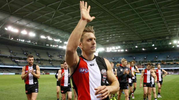 St Kilda's Sean Dempster leaves the field on Sunday after his 200th match.