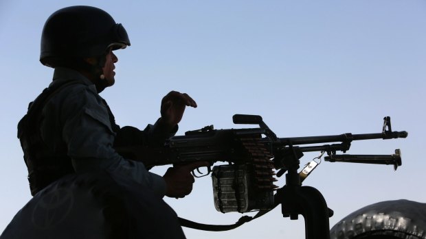 An Afghan security officer at the ready in Kabul on Tuesday.