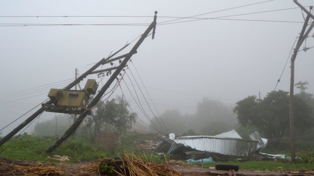 A collapsed house and broken electrical poles on the outskirts of the Malawi capital. 