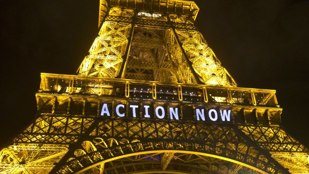 The Eiffel Tower lit up during the UN climate conference in Paris in 2015.