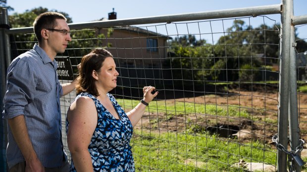 Chris and Christina Pilkington outside their cleared Ainslie Fluffy block, for which the government wants $725,000.