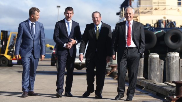 Member for Eden-Monaro Peter Hendy (second from right) with NSW state minister Andrew Constance, and Premier Mike Baird, during Prime Minister Malcolm Turnbull's visit to the wharf in Eden on the NSW south coast.