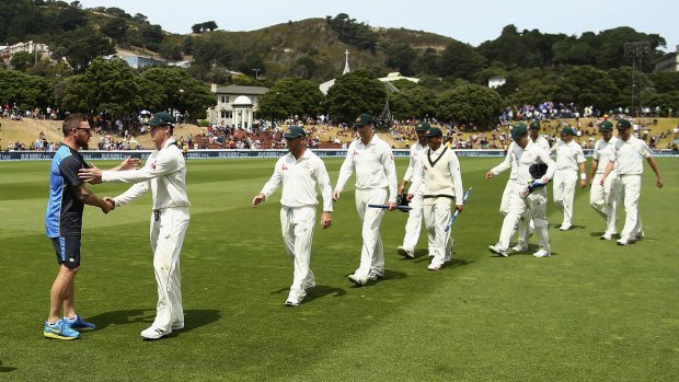 Job half done: Brendon McCullum congratulates Steve Smith after day four of the Test between New Zealand and Australia at Basin Reserve.