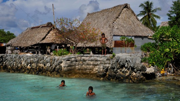 The village of Tebunginako in the Kiribati islands had to move because of rising seas and erosion. The new village is now under threat of inundation and sea walls have to be constantly maintained.