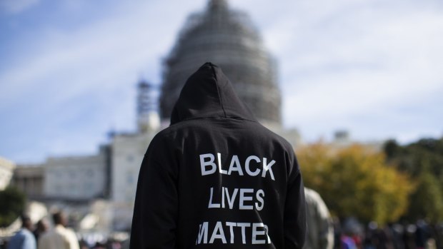 Neal Blair, of Augusta, Georgia, wears a hoodie which reads, "Black Lives Matter" as he stands on the lawn of the Capitol building during a rally to mark the 20th anniversary of the Million Man March in Washington on Saturday. 