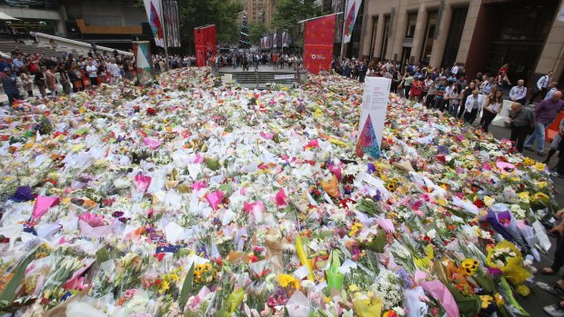 People queued up to lay their flowers at Martin Place. 