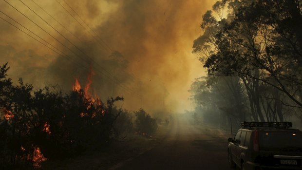 Parched properties: The risk of bushfires, like this near Lithgow last October, is elevated in a heatwave. 
