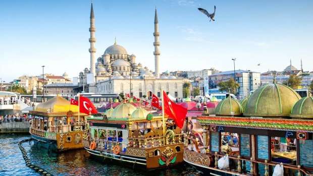 A view of the Suleymaniye Mosque and fishing boats in Eminonu, Istanbul, Turkey. 