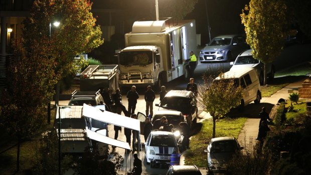 Police outside the property in Greenvale on Friday night.