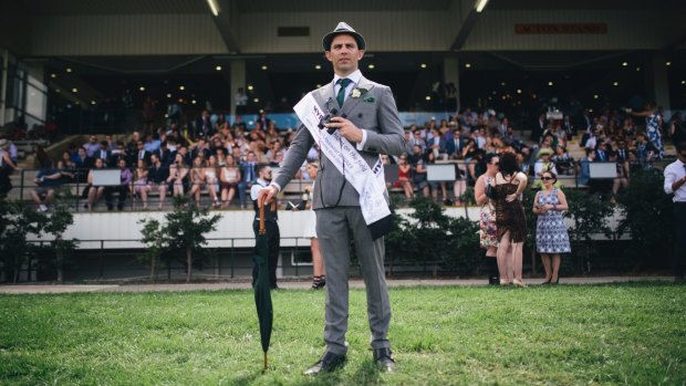 A classic grey suit with white shirt and green accessories made Hamish Lardi of Braddon the winner of Men's Fashions on the Field.
