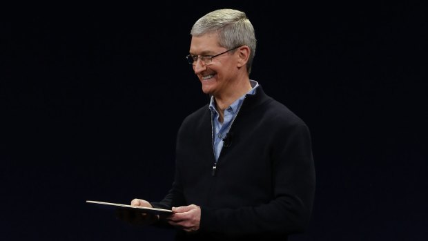 Apple CEO Tim Cook introduces the tiny machine.