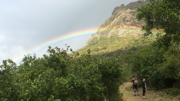 A rainbow appears near the start of the climb. 