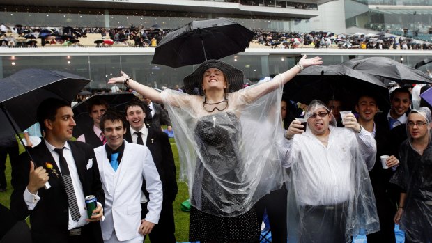 Rain invariably fails to dampen the spirits of Melbourne Cup revellers.