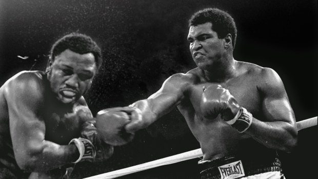 A hero to millions: Ali connects with a right against challenger Joe Frazier during their title fight in Manila.