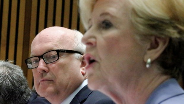 Attorney-General Senator George Brandis and Professor Gillian Triggs, President of the Human Rights Commission.