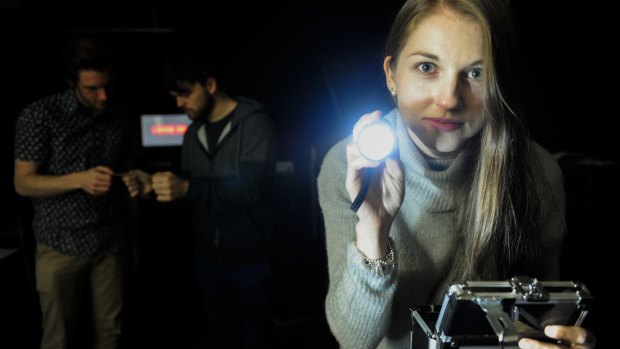 Siobhan Hynes, 22 and back from left, Chris Krajacic, 24 and Jesse Mount, 25 all of Franklin trying to fund Canberra's first escape room.