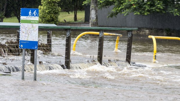 Norman Creek at Stones Corner overflowed on Saturday after the deluge.