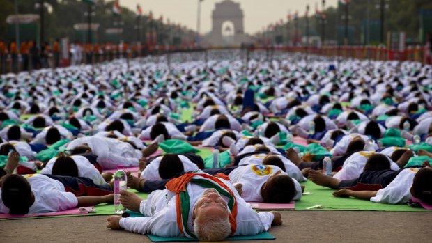 Indian Prime Minister Narendra Modi performs yoga along with thousands of Indians  in New Delhi.