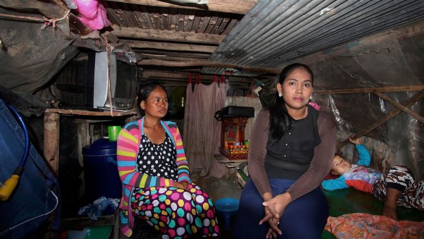 Inside Hour Vanny's cramped shanty home with her sister-in-law Som Tha Satry, 33, who gave birth to twins in October.