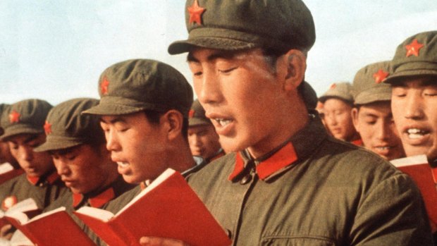 Communist propapanda: China's Red Army soldiers read from Mao Zedong's "Little Red Book"  