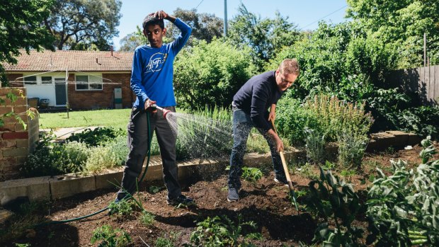 Rashmika Pathmaperuma and Ben Lane working in the garden. Rashmika, 16, has Fragile X Syndrome as well as austism and intellectual imparement, and Ben Lane has been nominated in the Chief Minister's Inclusion Awards.