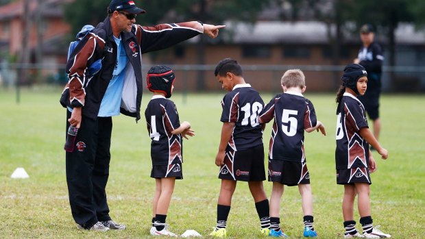A coach gives instructions to his young players at Allsopp Oval.